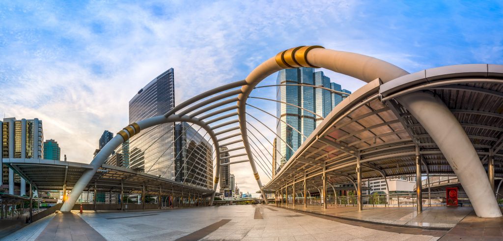 Architecture, Metropolitan area, Building, Daytime, Urban area, Sky, Commercial building, Photography, Bridge, City, Skyway, Downtown, Convention center, BTS Skytrain